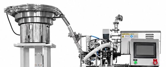 Upper part of the LV-160 spout pouch filler: a vibratory bowl feeder for caps, a nozzle head and a touchscreen.